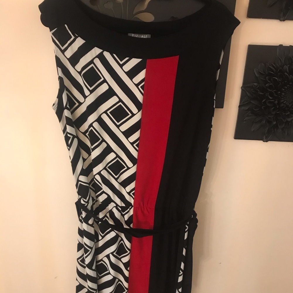 Black and white dress with a splash of red.